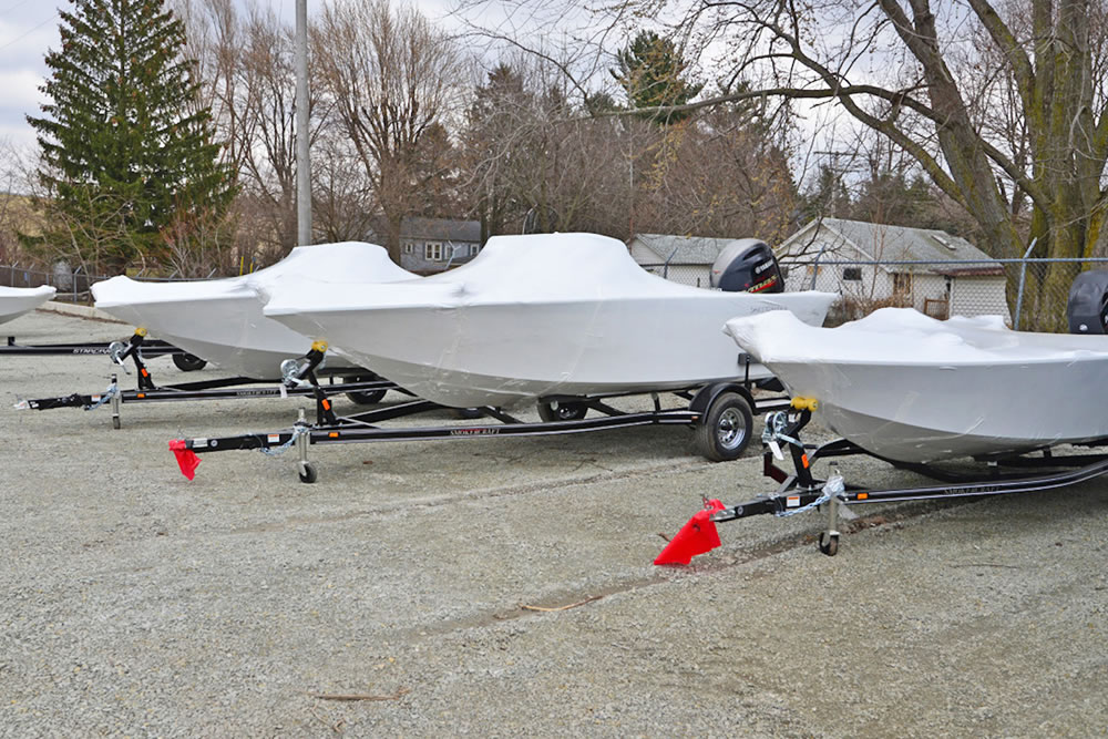 Completed boats are shrink wrapped then shipped off to the dealership.