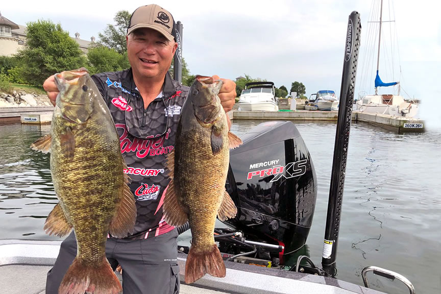 Canadian tournament pro Bob Izumi likens topwater fishing to playing with his cat, noting that pauses in the retrieve can trigger big strikes. 